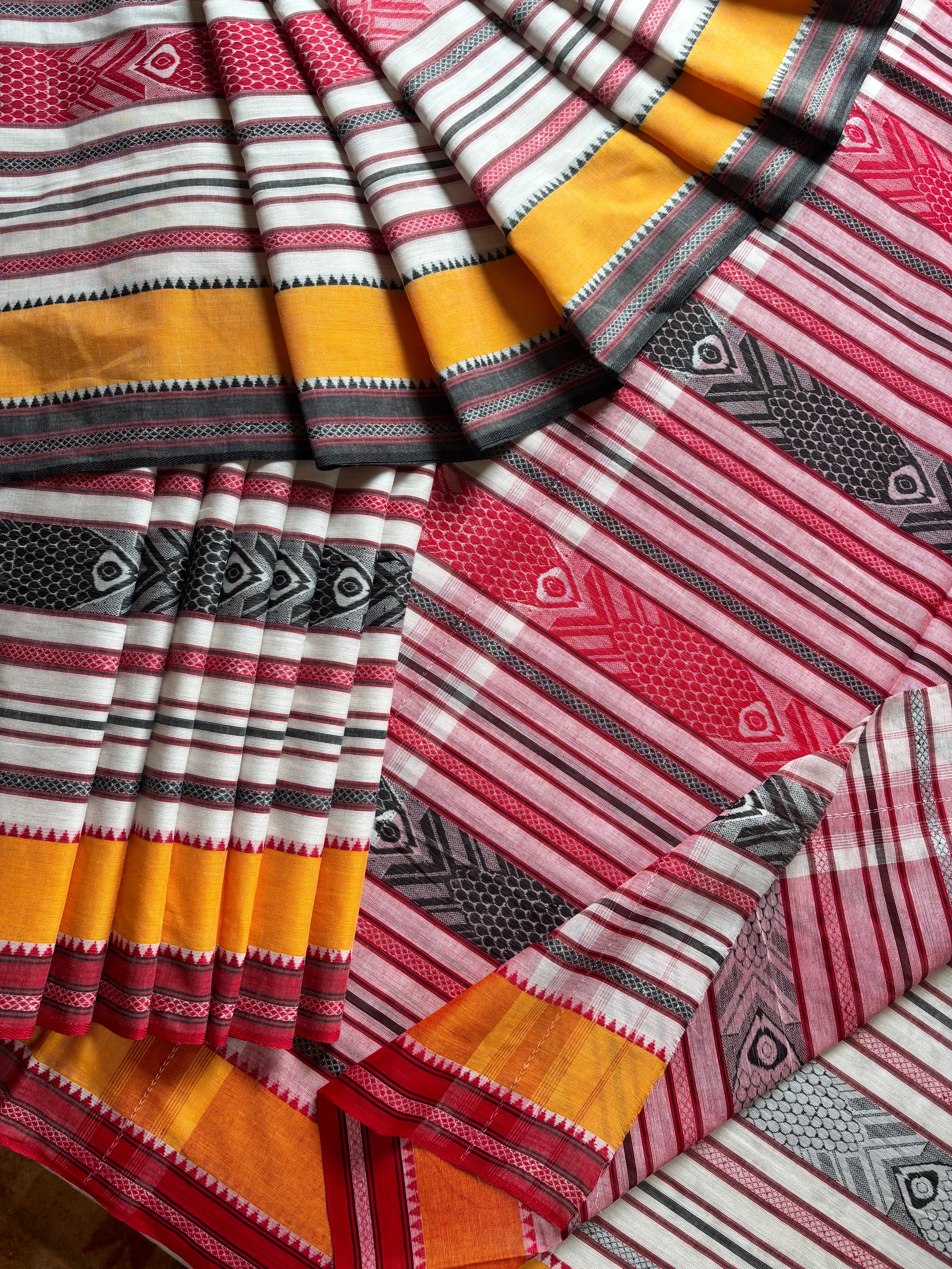 White with Red, Black and Yellow Fish Motifs Dhonekhali Saree