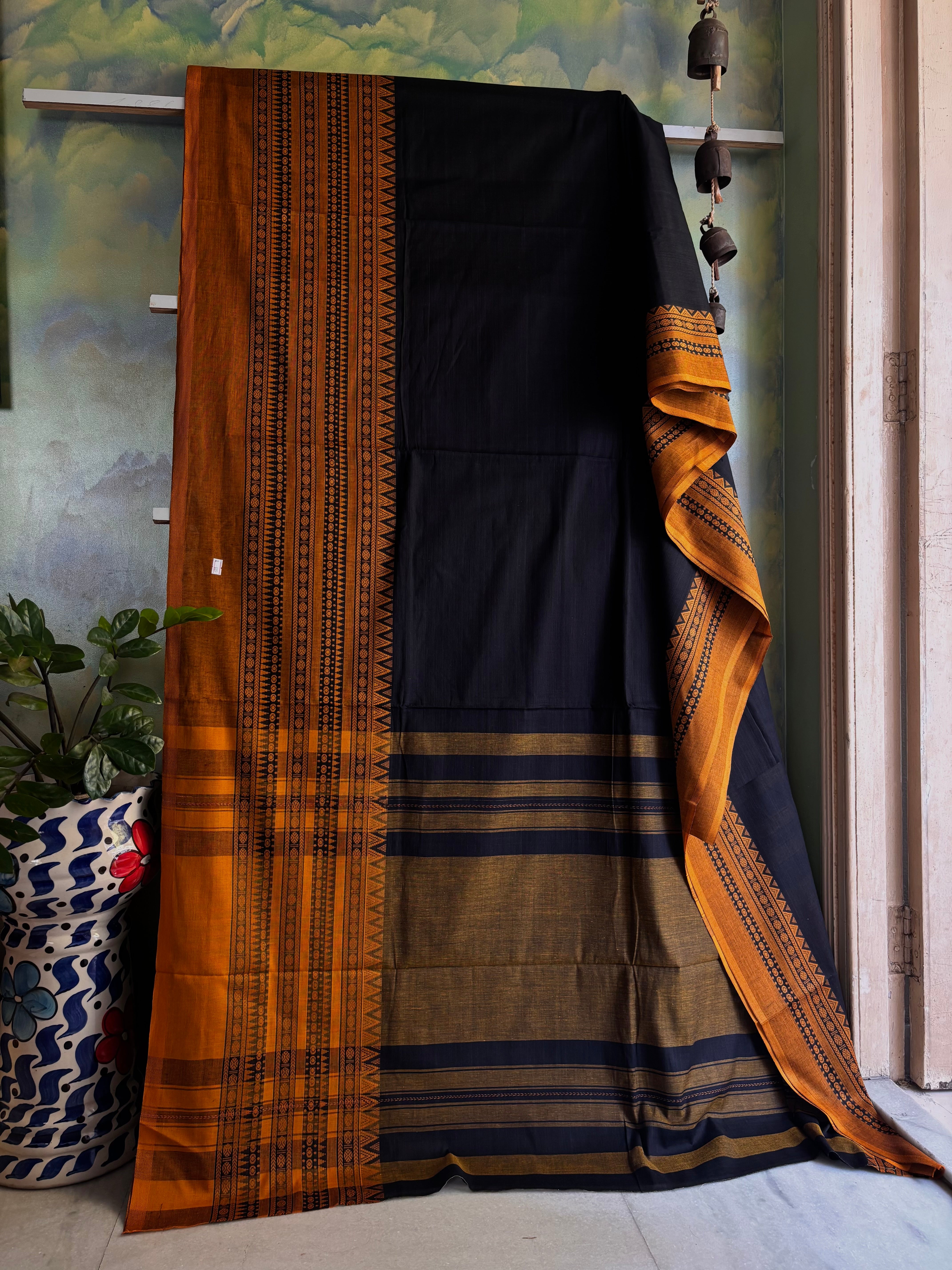 Handwoven Black Orangish Yellow Cotton Dhonekhali Saree